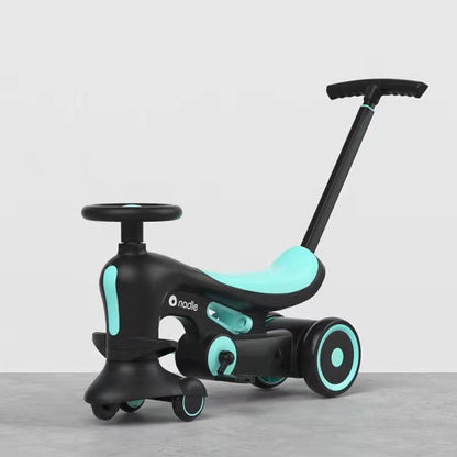 A black and teal ride-on toy with a push handle, set against a light gray background.