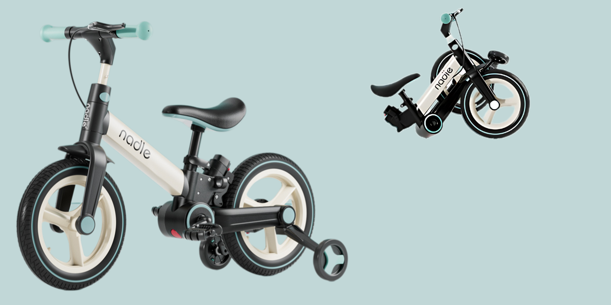 Folding children's bike in sleek design, featuring black and cream colors.